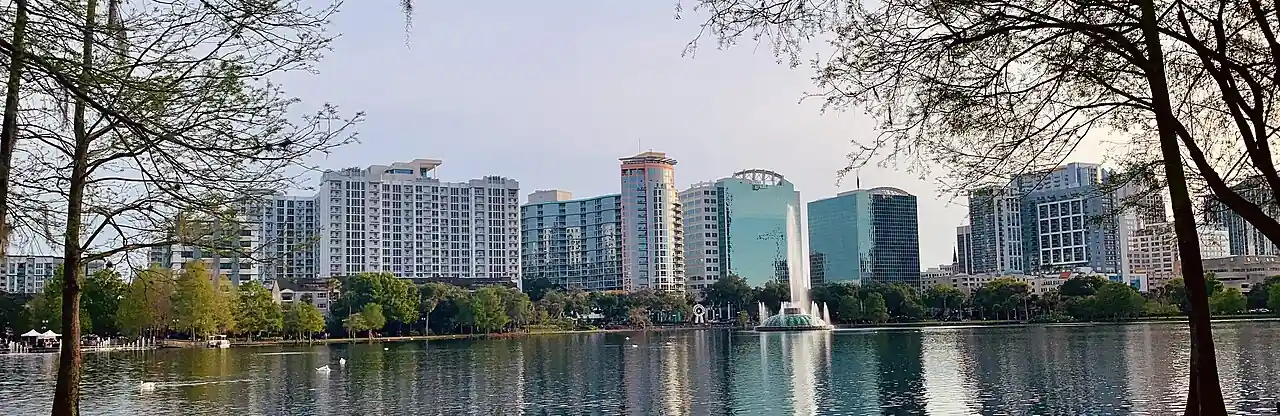 Residential and office high-rises around Lake Eola seen from the lakeshore in downtown Orlando