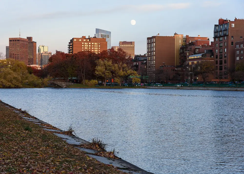 Condo insurance Massachusetts: residential buildings reflected in Storrow Lagoon on the Charles River Esplanade