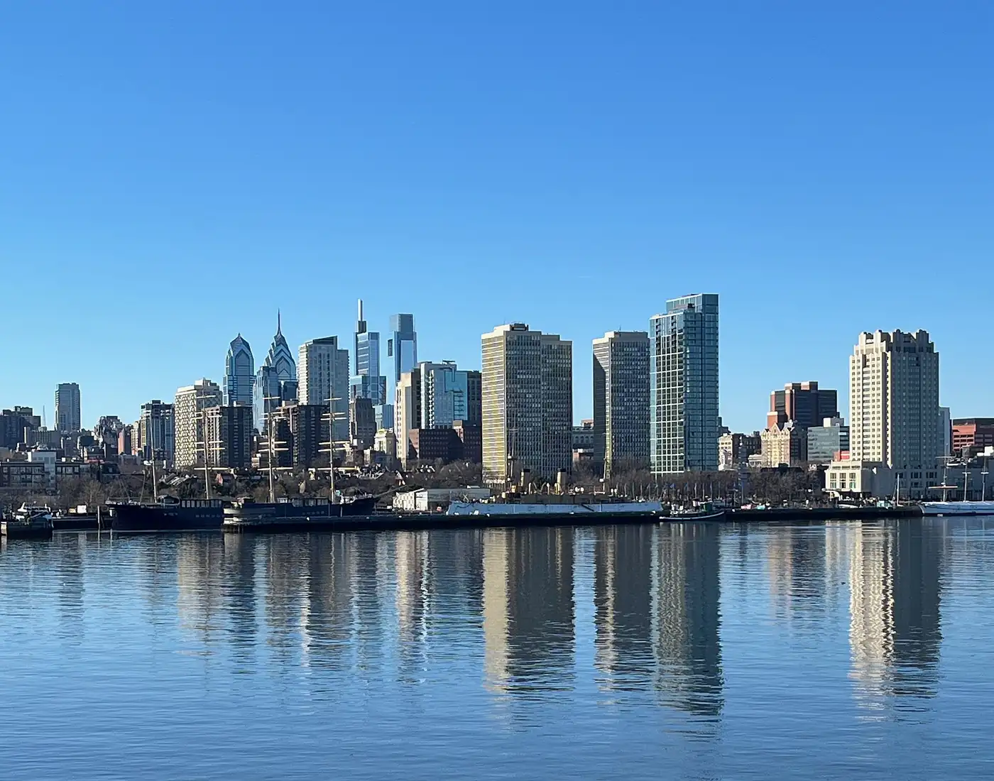 Pennsylvania condo insurance: Center City Philadelphia skyline and Delaware River waterfront towers seen from the Camden waterfront